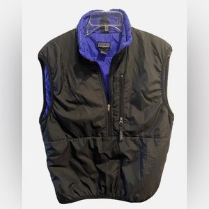 Mens sized small black outside with the purple inside 90’s vest; Patagonia brand